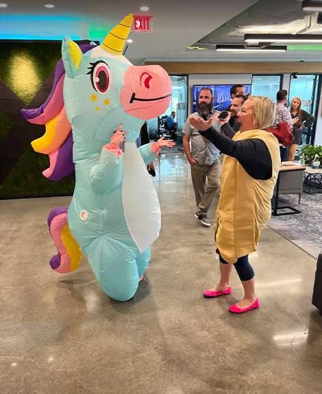 Expel employees dressed as unicorn and hot dog at HQ